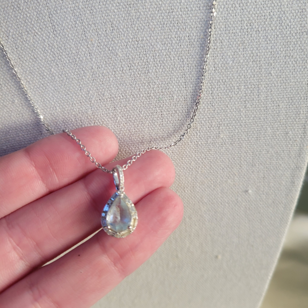 Oval Aquamarine and 0.19 Diamond Halo Pendant Necklace In 10K White Gold
